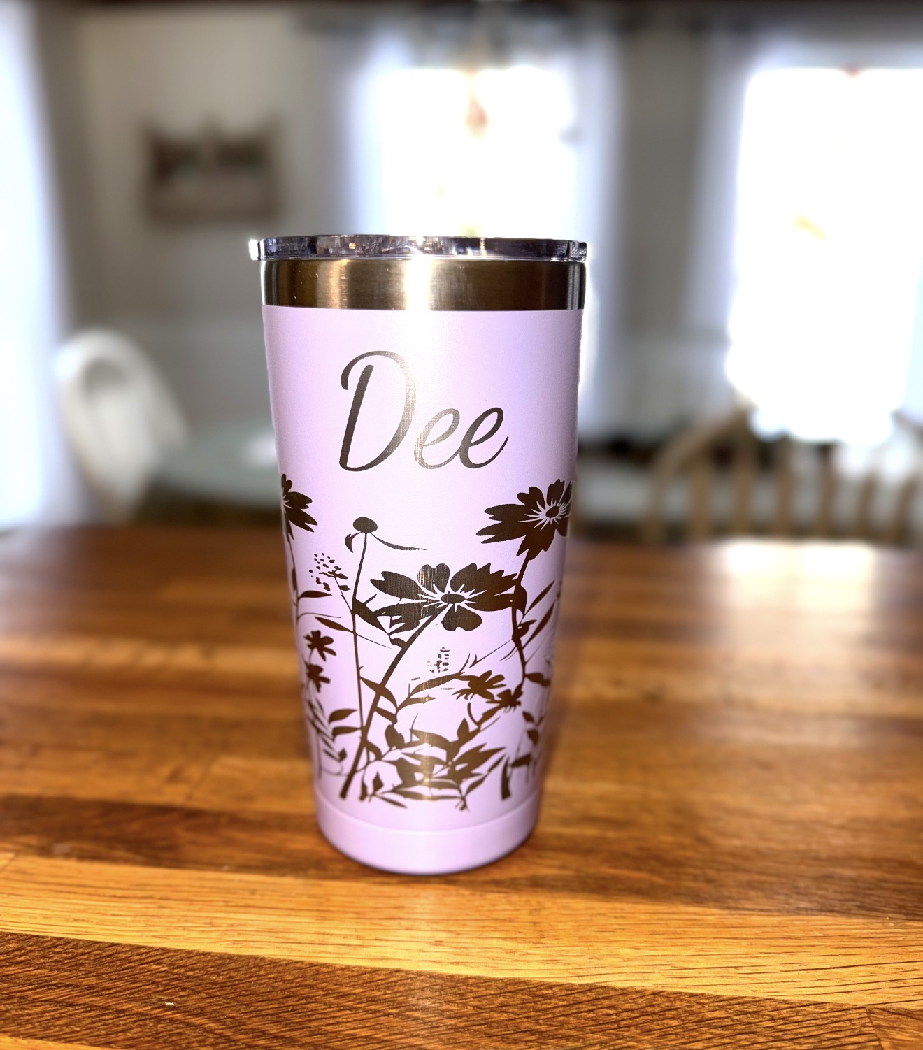 Pink tumbler engraved with the name Dee and a wildflower design